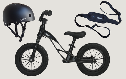 Black balance bike with black kids helmet and balance bike carry strap - bundle pack