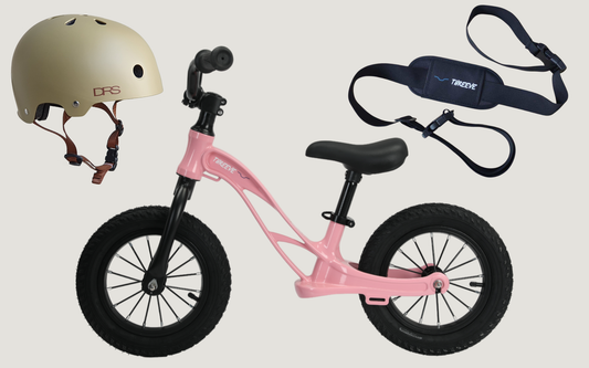 Pink balance bike with khaki kids helmet and balance bike carry strap - bundle pack